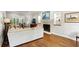 Open living room with hardwood floors, fireplace, and views into the dining area at 230 Seamarsh Ct, Atlanta, GA 30328