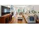 Cozy living room showcasing hardwood floors, a fireplace, and a large sectional sofa at 230 Seamarsh Ct, Atlanta, GA 30328