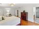 Spacious bedroom features hardwood flooring and ensuite access to the bathroom at 230 Seamarsh Ct, Atlanta, GA 30328