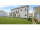 Spacious backyard featuring a lush green lawn and the rear view of a well-maintained two-story home at 351 Boundless Ln, Canton, GA 30114