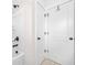 Modern bathroom showcasing a shower and white doors with matte black hardware at 351 Boundless Ln, Canton, GA 30114