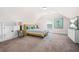 Spacious bedroom features a dormer ceiling, carpet floors, and a large flat screen TV at 351 Boundless Ln, Canton, GA 30114