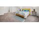 Spacious bedroom features a dormer ceiling, carpet floors, and a yellow accent bed at 351 Boundless Ln, Canton, GA 30114