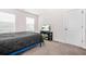 Comfortable bedroom with two windows, carpet floors, and a TV on a media center at 351 Boundless Ln, Canton, GA 30114