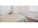 Cozy bedroom with a large window and doorway to the on-suite bathroom at 351 Boundless Ln, Canton, GA 30114
