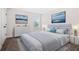 Bright bedroom with neutral tones, featuring a queen bed, a dresser, and tasteful artwork at 351 Boundless Ln, Canton, GA 30114