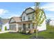 Beautiful home with a well-manicured lawn and a young tree in the front yard, enhancing its curb appeal at 351 Boundless Ln, Canton, GA 30114