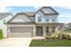 Charming two-story home with stone accents, manicured lawn, and a two-car garage offers excellent curb appeal at 351 Boundless Ln, Canton, GA 30114