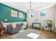 Bright living room featuring modern furniture, trendy decor, and ample natural light from several windows at 351 Boundless Ln, Canton, GA 30114