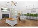 Open living space features a fireplace, modern seating, and seamless transition to the kitchen area at 351 Boundless Ln, Canton, GA 30114