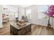 Bright living space with wood floors, a large window and seating area near the main bedroom at 351 Boundless Ln, Canton, GA 30114