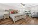 Spacious bedroom featuring hardwood floors, a tray ceiling, and large windows for ample natural light at 351 Boundless Ln, Canton, GA 30114