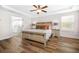 Bright main bedroom with a ceiling fan, wood accents, and an ensuite bathroom at 351 Boundless Ln, Canton, GA 30114