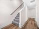 Clean staircase with carpeted steps and hardwood landing, leading to the upper level of the home at 351 Boundless Ln, Canton, GA 30114