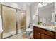 Bathroom with a glass shower, granite countertop vanity, and white toilet at 5115 Edgebrook Dr, Cumming, GA 30040