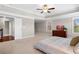 Expansive primary bedroom featuring a tray ceiling and large windows with natural light at 5115 Edgebrook Dr, Cumming, GA 30040