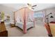 Charming bedroom featuring a decorative bed and sunny windows with views of the neighborhood at 5115 Edgebrook Dr, Cumming, GA 30040