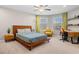 Bright bedroom with stylish decor, including a decorative ceiling fan and natural light at 5115 Edgebrook Dr, Cumming, GA 30040