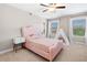 Cozy bedroom features an upholstered bed, and sunny windows with beautiful views at 5115 Edgebrook Dr, Cumming, GA 30040