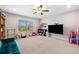 Bedroom features a ceiling fan, window, and carpet flooring at 5115 Edgebrook Dr, Cumming, GA 30040