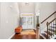 Bright foyer with hardwood floors, and large glass front door allowing for lots of natural light at 5115 Edgebrook Dr, Cumming, GA 30040