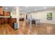 Spacious game room with hardwood flooring, ping pong table, wet bar, and ample lighting at 5115 Edgebrook Dr, Cumming, GA 30040