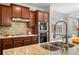 Kitchen with tile backsplash, stainless steel appliances, and granite countertops at 5115 Edgebrook Dr, Cumming, GA 30040
