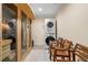 Laundry area with modern stacked washer and dryer and access to the sauna at 5115 Edgebrook Dr, Cumming, GA 30040