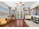 Inviting living area features hardwood floors, a ceiling fan, and multiple windows letting in lots of light at 5115 Edgebrook Dr, Cumming, GA 30040