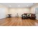 Open-concept living room with hardwood flooring, seating, and plenty of natural light at 5115 Edgebrook Dr, Cumming, GA 30040
