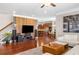 Open concept living room and kitchen with a statement wall at 5115 Edgebrook Dr, Cumming, GA 30040