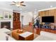 Open living area with fireplace, built-ins, and a statement wall at 5115 Edgebrook Dr, Cumming, GA 30040