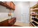 Mudroom area with built-in storage cabinets, bench, and shoe rack at 5115 Edgebrook Dr, Cumming, GA 30040