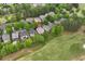 Residential aerial view showcasing an entire neighborhood adjacent to the golf course, offering a tranquil and picturesque setting at 5309 Davenport Mnr, Cumming, GA 30041