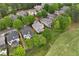 Aerial shot of a home surrounded by lush greenery and a meticulously maintained golf course, nestled in a beautiful community at 5309 Davenport Mnr, Cumming, GA 30041