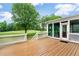 Outdoor deck with a golf course view, white railing, and plenty of space for seating at 5309 Davenport Mnr, Cumming, GA 30041