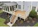 Enjoy the spacious backyard with a custom deck and landscaped garden, perfect for entertaining or peaceful relaxation at 5309 Davenport Mnr, Cumming, GA 30041