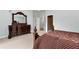 Bedroom featuring elegant wood furnishings, neutral walls, and plush carpeting at 5309 Davenport Mnr, Cumming, GA 30041