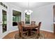 Bright breakfast nook featuring a round table, four chairs, and natural light from large windows at 5309 Davenport Mnr, Cumming, GA 30041