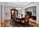 Elegant dining room with hardwood floors, natural light, and classic furnishings at 5309 Davenport Mnr, Cumming, GA 30041