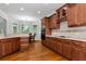 Gourmet kitchen with wooden cabinets, stainless steel appliances, and a cozy breakfast nook at 5309 Davenport Mnr, Cumming, GA 30041