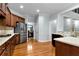 Well-appointed kitchen featuring stainless steel appliances and hardwood floors at 5309 Davenport Mnr, Cumming, GA 30041