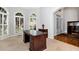 Inviting home office space with neutral colors, large desk, and ample natural light at 5309 Davenport Mnr, Cumming, GA 30041