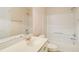 Bathroom features a single sink vanity, mirror, and shower-tub combo at 650 Virginia Highlands, Fayetteville, GA 30215
