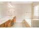 This bathroom has tile floors, double sinks, and a separate tub at 650 Virginia Highlands, Fayetteville, GA 30215