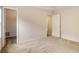 Carpeted bedroom features a walk-in closet, neutral paint, and ceiling fan at 650 Virginia Highlands, Fayetteville, GA 30215