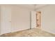 Carpeted bedroom boasts neutral paint and a doorway to the hallway at 650 Virginia Highlands, Fayetteville, GA 30215