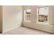 Bedroom with neutral walls, carpeting, and two windows offering natural light at 650 Virginia Highlands, Fayetteville, GA 30215