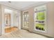 Sunlit living room with large windows offering serene outdoor views at 650 Virginia Highlands, Fayetteville, GA 30215