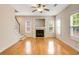 Bright living room featuring hardwood floors, fireplace, and natural light from multiple windows at 650 Virginia Highlands, Fayetteville, GA 30215